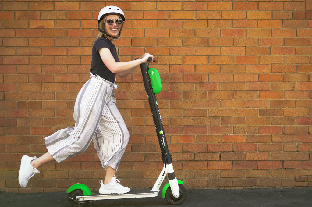 Girl on Lime scooter